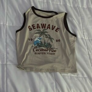 Tan/beige cropped tank top for vacation.